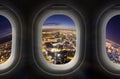 City at night through airplane window Royalty Free Stock Photo