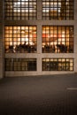 City at Night - Diners in Restaurant Cafe through Window