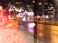 city night light  street reflection  car traffic buildings blurred light red yellow bokeh vew from window urban  holiday  li Royalty Free Stock Photo