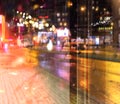 Rainy city night light  street reflection  car traffic buildings blurred light red yellow bokeh vew from window urban  holiday  li Royalty Free Stock Photo