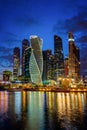 City. Night. Reflection in the water of skyscrapers, bright vivid glowing high buildings, modern lighting. Royalty Free Stock Photo