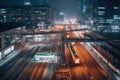 A city at night with trains on the tracks and buildings in the photo is taken from an overpass bridge. Generative Ai