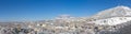 City panorama against mountains. Royalty Free Stock Photo