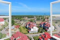 City panorama visible from home. Opened window