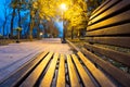 City park alley, bench, trees and lanterns. Night city park Royalty Free Stock Photo