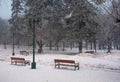 City park with benches and lantern in hoarfrost Royalty Free Stock Photo