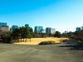 City park with building and blue sky background