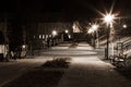 City park in the night scenery with a place to rest. Landscape of night city park in the spring. Benches, paths and lights. Royalty Free Stock Photo