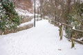 City park road with snow in winter