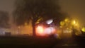 A city park with street lights on a misty winters night. With a blurred, bokeh, out of focus edit Royalty Free Stock Photo