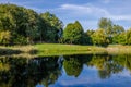 City park in the warm and sunny day during the autumn season. Landscape fulfilled of sunlight Royalty Free Stock Photo