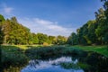 City park in the warm and sunny day during the autumn season. Landscape fulfilled of sunlight Royalty Free Stock Photo