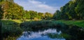 City park in the warm and sunny day during the autumn season. Landscape fulfilled of sunlight Royalty Free Stock Photo