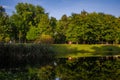 City park in the warm and sunny day during the autumn season. Landscape fulfilled of sunlight Royalty Free Stock Photo