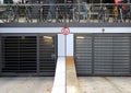 City parkinglot entrance with bicycles on top Royalty Free Stock Photo