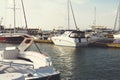 City pier with many different yachts