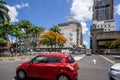 City of Port Louis, Mauritius. A red car on one of the busy roads of the city centre.