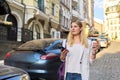 City portrait of young beautiful business woman walking down the street Royalty Free Stock Photo