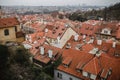 City of Prague with red roofs and Church in fog. City view of Praha old city. Rustic grey colors toning Royalty Free Stock Photo