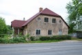 City Priekuli, Latvian Republic. Old house and street view. Windows and roof. Jun 1. 2019 Travel photo