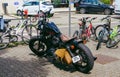 City public parking with black Harley Davidson Sportster motorcycles chopper
