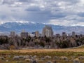 City of Reno Nevada cityscape with hotels and casinos and snow covered mountains in the background.
