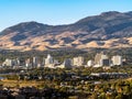 City of Reno Nevada cityscape with hotels and casinos with a blue sky.