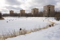 City Riga, Latvia. Frozen river and anglers fishing fish