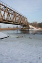 City Riga, Latvia. Old railway bridge and river in winter.Travel photo Royalty Free Stock Photo