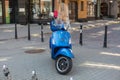 City Riga, Latvian Republic. A blue scooter is standing on the street.2019. 24. July