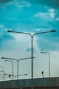 City road and electric post, landscape. cityscape against blue sky in summer  background Royalty Free Stock Photo