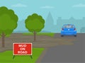 City road with `Mud on road` warning sign. British road sign. Traffic flow on a city road. Back view of a red sedan car. Royalty Free Stock Photo