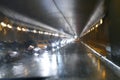 Road traffic in rainy night tunnel with cars and lights blur effect Royalty Free Stock Photo