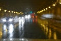 Road traffic in rainy night tunnel with cars and lights blur effect Royalty Free Stock Photo