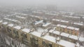 City rooftops patio with snow in winter day.