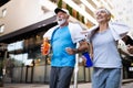 City running couple jogging outside. Senior couple runners training outdoors Royalty Free Stock Photo