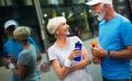 City running couple jogging outside. Senior couple runners training outdoors Royalty Free Stock Photo