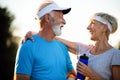 City running couple jogging outside. Senior couple runners training outdoors Royalty Free Stock Photo