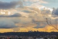 City scape and downtown city towers with panaramic sunset clouds