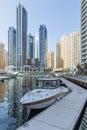 City scape with modern high-rise buildings, man made river with yachts and blue sky in background at Dubai Royalty Free Stock Photo