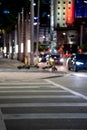 City scene focus on crosswalk striped lines