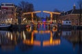 City scenic from Amsterdam at the Amstel in the Netherlands at night Royalty Free Stock Photo
