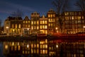 City scenic from Amsterdam at the Amstel in the Netherlands at night Royalty Free Stock Photo
