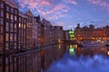 City scenic from Amsterdam by night in the Netherlands at sunset Royalty Free Stock Photo