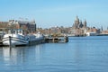 City scenic from  the harbor of Amsterdam with the St. Niklaas church Royalty Free Stock Photo