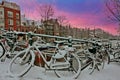 City scenic from snowy Amsterdam the Netherlands at sunset Royalty Free Stock Photo