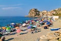 The city of Scilla Calabria Italy. Leisure time at Marina Grande beach in summer and the Ruffo Castle Royalty Free Stock Photo