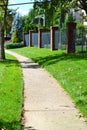 City sidewalk winds through neighborhood