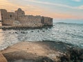 The city of Sidon in Lebanon. Sidon Sea Castle, built by the crusaders - Saida corniche and building. Sidon sea at sunset