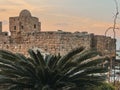 The city of Sidon in Lebanon. Sidon Sea Castle, built by the crusaders - Saida corniche and building. Sidon sea at sunset Royalty Free Stock Photo